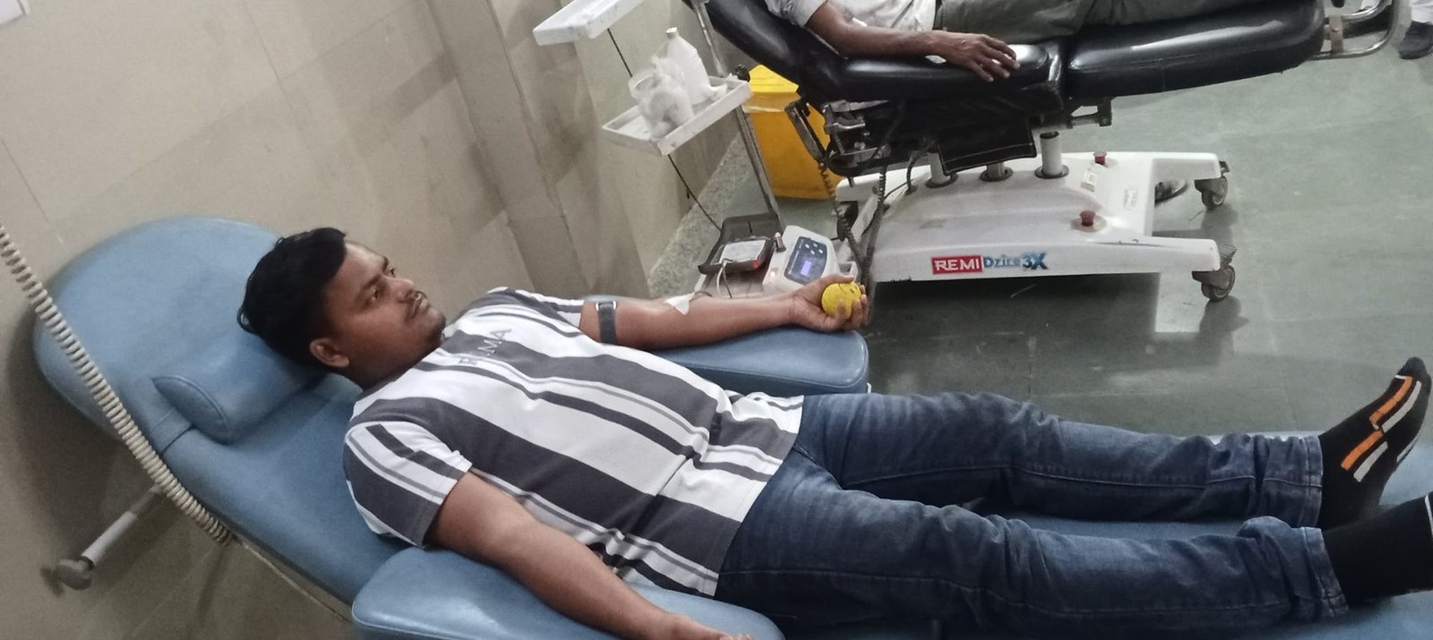 Man donating blood highlighting benefits of blood donation and social work initiative